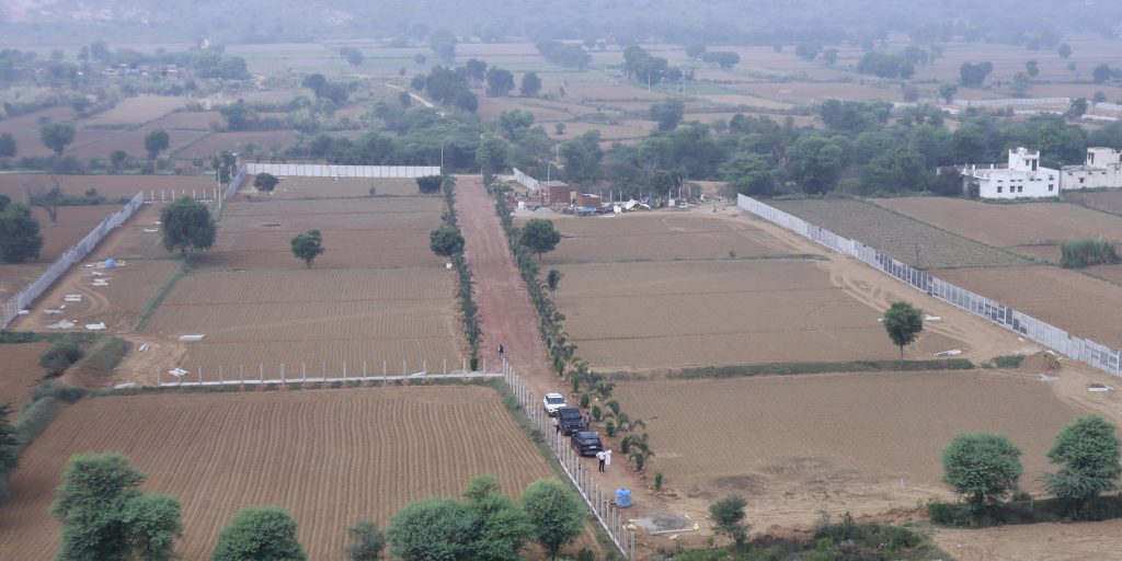 Premium Farmhouse Living in Alwar: Gated Farmland Near NCR